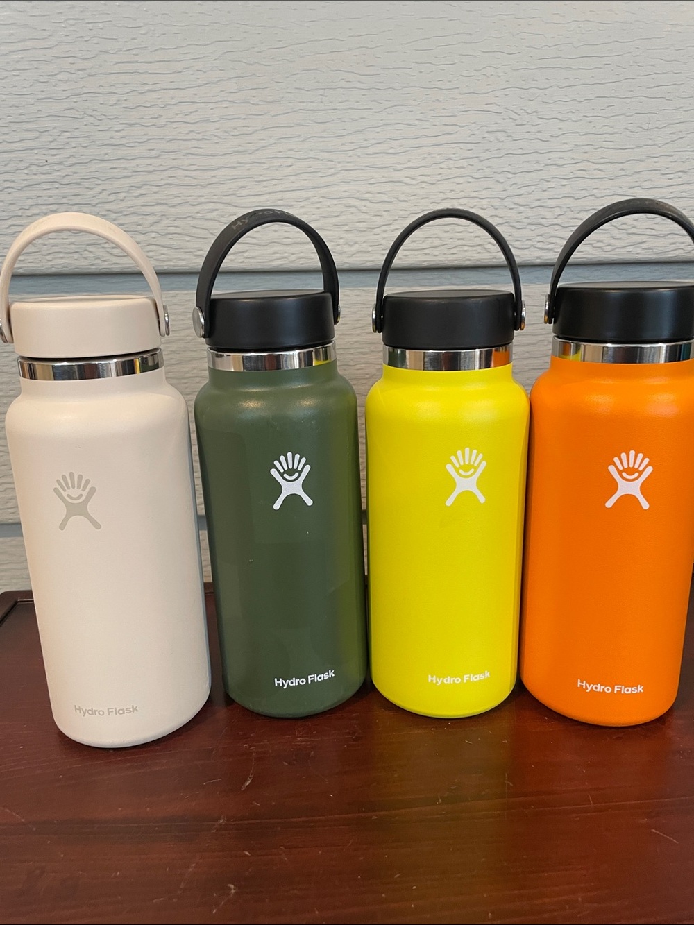 Hydro Flask 4-Pack Insulated Bottles in Cream, Olive, Yellow, and Orange